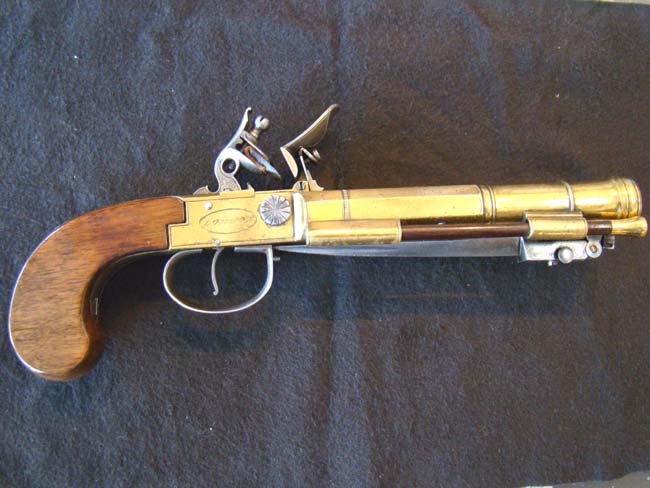 A RARE English Brass Double Cannon Barrel Flintlock Pistol with spring bayonet by Dawes, London, circa 1790.